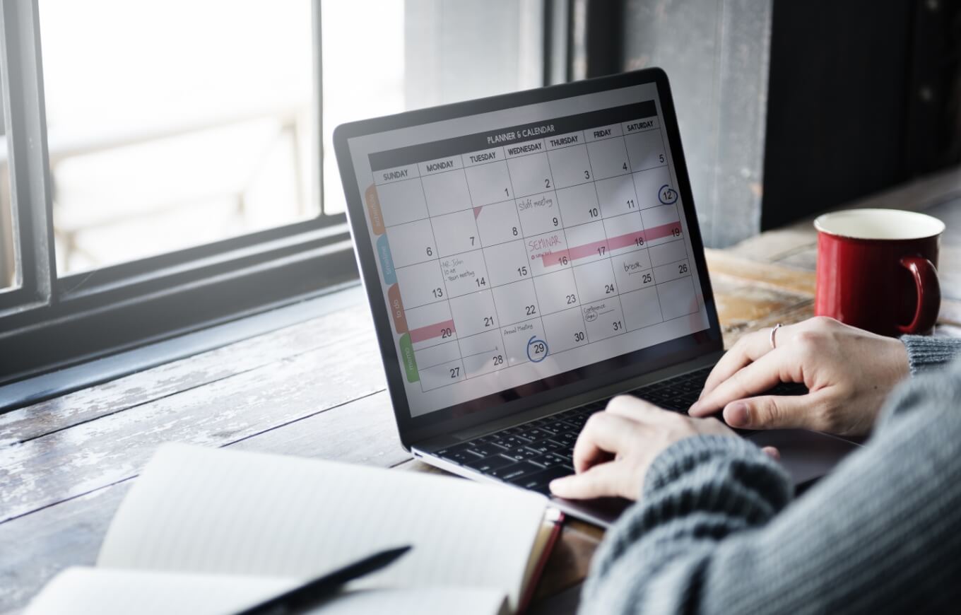 A person using a digital calendar.
