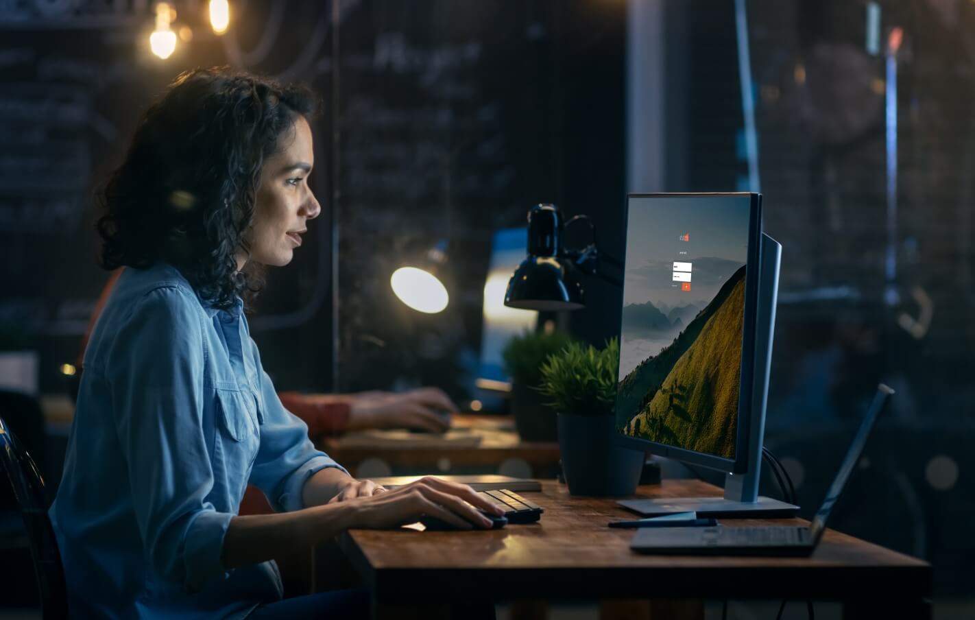 A woman working on her computer.